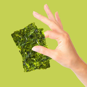 Hand holding organic olive oil seaweed | Morish Snacks