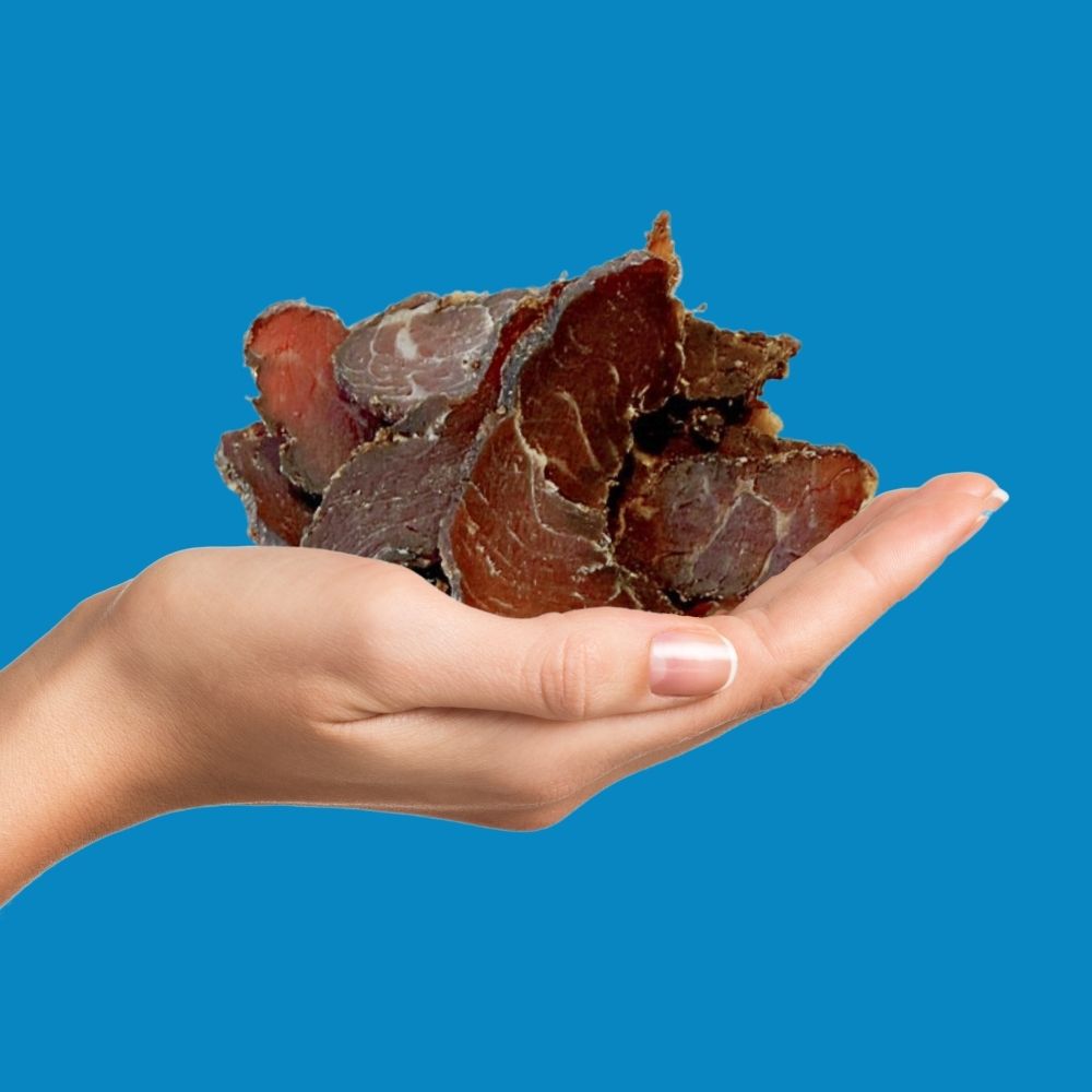 Hand holding succulent beef bites | Morish Snacks