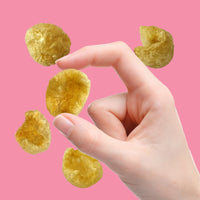 Hand with crunchy pork bites | Morish Snacks